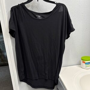 Tek Gear Women's Black Short Sleeve Top. With lattice style sleeves.